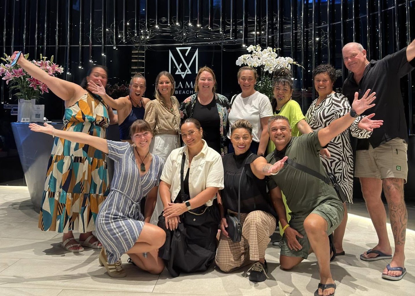A hosted group celebrating together in their Da Nang hotel lobby
