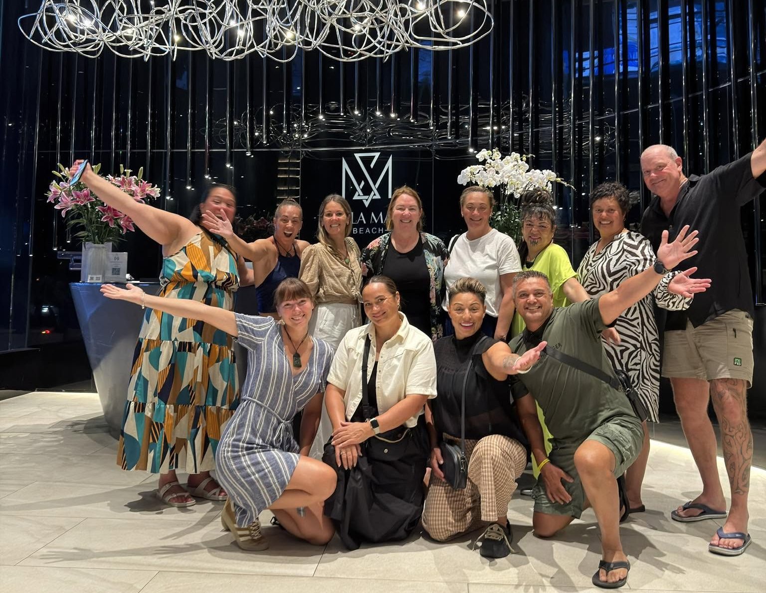 A hosted group celebrating together in their Da Nang hotel lobby